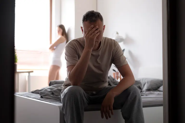 Couple looking concerned, illustrating the impact of Peyronie's disease and penile curvature