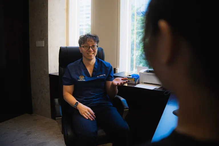 Doctor in consultation with a patient at a health screening clinic in Singapore